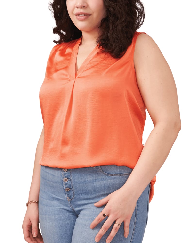 Front of a model wearing a size 1X Elena Sleeveless Blouse in SUNSET CORL by Vince Camuto. | dia_product_style_image_id:261416